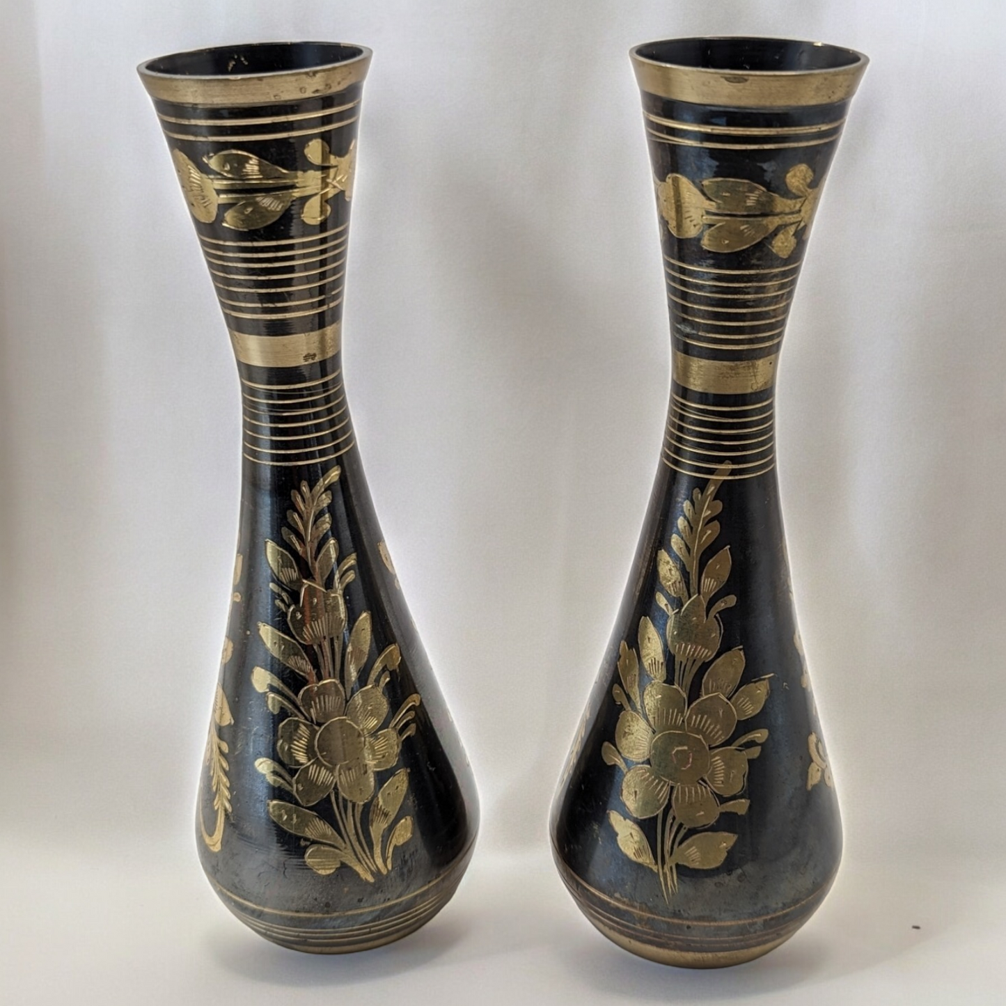 Pair of Vintage Indian Black and Gold Brass Metal Footed Vases - Etched Ornate Floral Motif